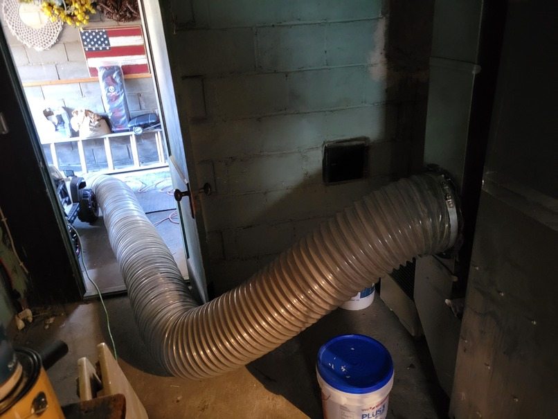 Vacuum_hose_connected_wayne vacuum hose connected to duct in Wayne home